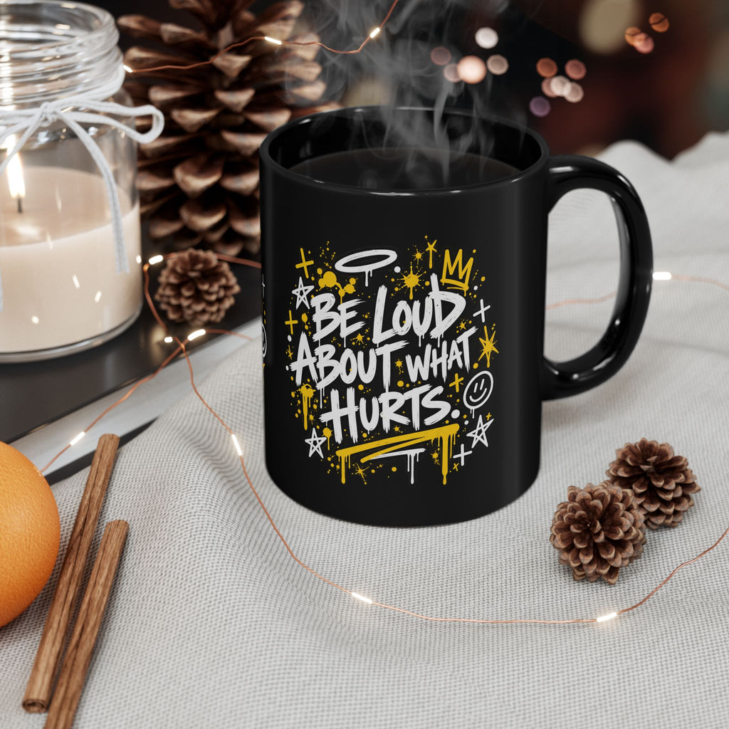 Outside The Lines Mug with Be Loud About What Hurts design and steaming coffee