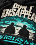 Close-up of black MUD STAY zip hoodie back print with Don’t Disappear message and teal graphic