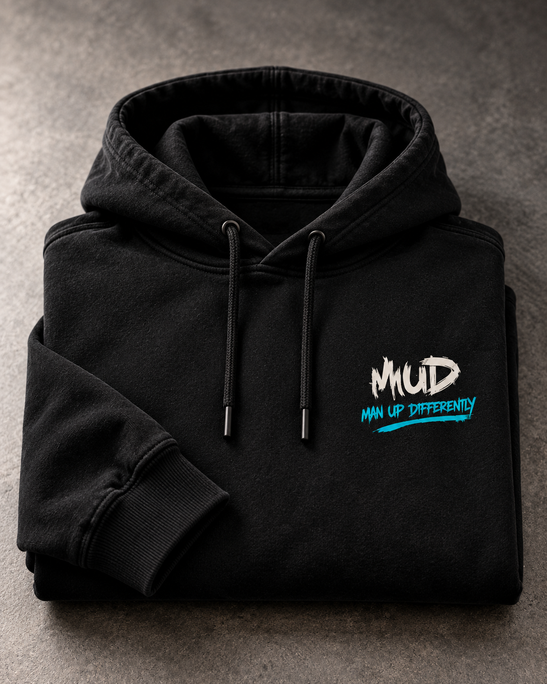 Folded black MUD After Dark Hoodie showing MUD chest logo
