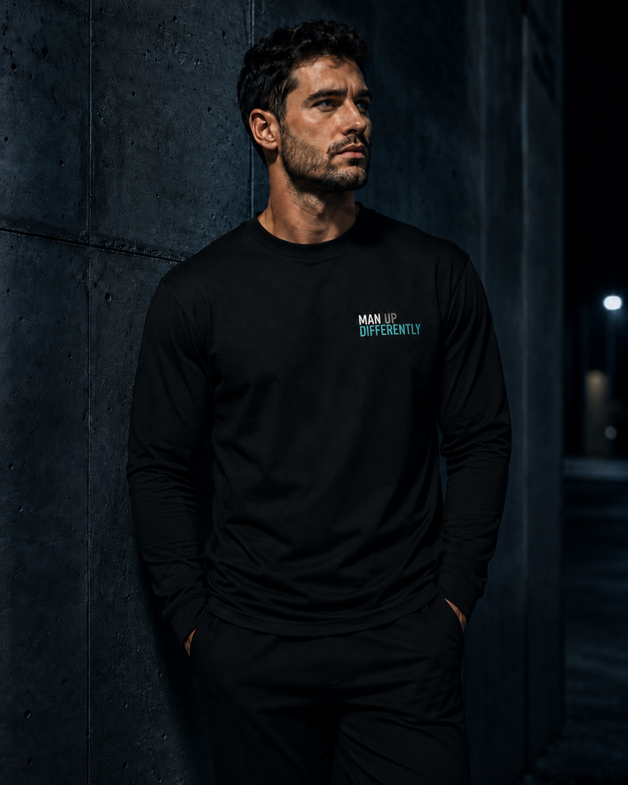 Model wearing MUD Essential Long Sleeve with small Man Up Differently chest logo